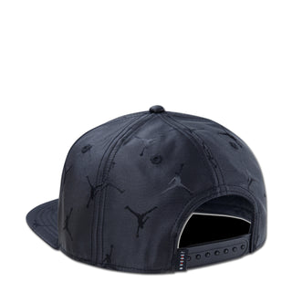 Youth black snapback cap, side view with embroidered Jumpman jacquard and open back