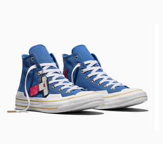 Two men's blue high-top sneakers with white laces and yellow side stripe; graphic tag on tongue