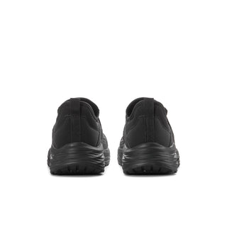 Women's black slip-on sneakers from back view, cushioned collar and heel