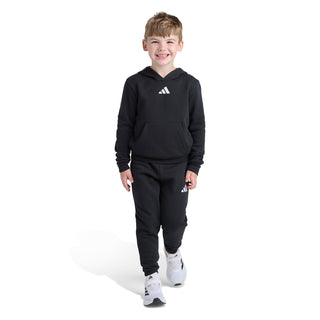 Kids black fleece pullover hoodie and jogger set with adidas logo, standing
