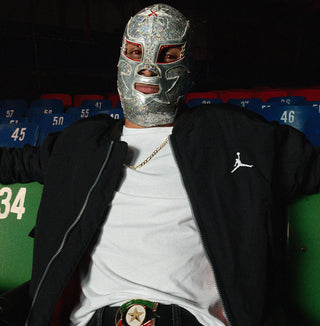 male posing with lucha libre mask