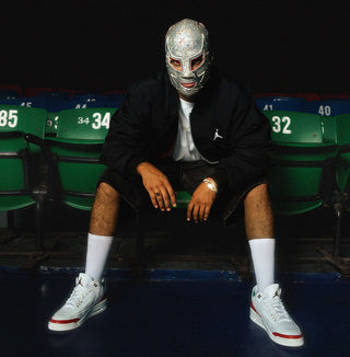 male posing with lucha libre mask