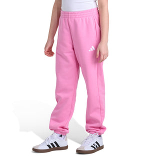 Youth pink fleece jogger pants, side view, elastic cuffs and small white logo detail