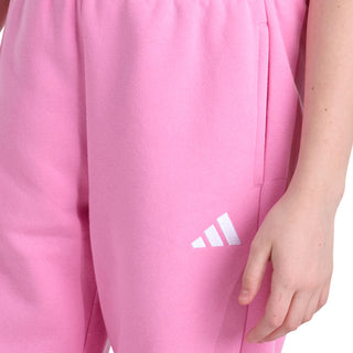 Pink fleece jogger pants with small white logo and ruched elastic waistband detail