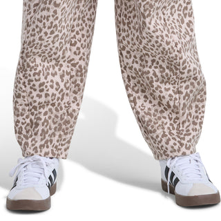 Youth leopard-print barrel-leg pants with ankle cuff and sneakers shown