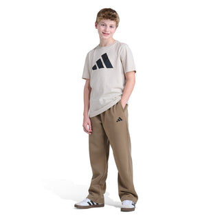 Khaki youth fleece jogger pants with adidas logo, side view on model