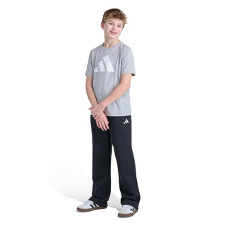 Youth black fleece jogger pants standing look with side logo on leg