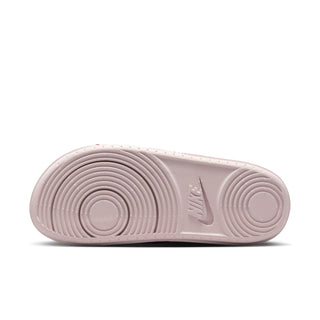 Slide sandal outsole with circular traction pattern and small NIKE mark