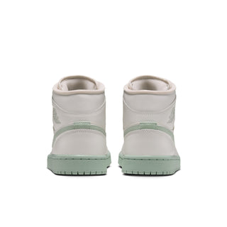 Women's mid-top sneakers heel view in white with mint midsole and branding
