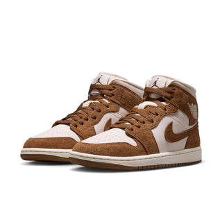 Women's mid-top sneakers, brown and tan suede with white toe caps and Swoosh