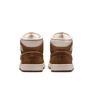 Women's mid-top sneakers shown from back with brown suede heels and white collars