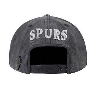 Washed black/gray snapback cap with SPURS text on front and adjustable back strap