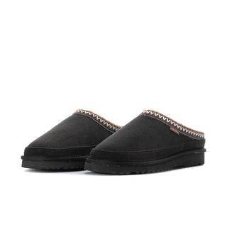 Pair of black womens Carson slipper mules with fuzzy trim and black rubber sole
