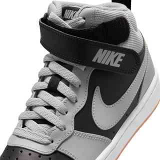 Youth sneaker upper close-up: gray laces and mesh with black Nike heel panel.