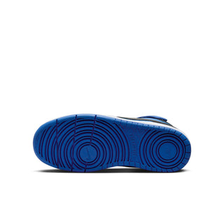 Youth sneaker outsole with blue tread and circular traction pattern