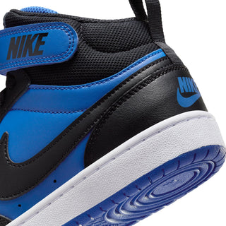 Youth sneaker side detail with blue overlay, black strap, and Nike logo
