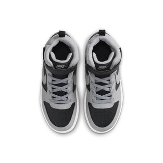 Kids sneakers showing black and light gray uppers with lace eyelets and Nike heel label.