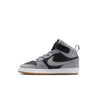 Kids mid-top sneaker side view in light gray with black panels; Nike Swoosh, gum outsole.