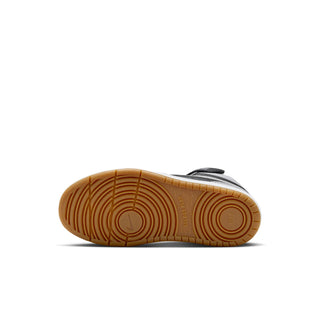 Kids sneaker outsole in gum brown with circular tread pattern.