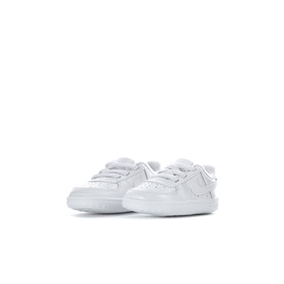 Infant white low-top sneakers, side view, lace-up with swoosh logo
