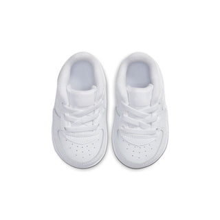 Infant white low-top sneakers, front view, padded collar and lace-up