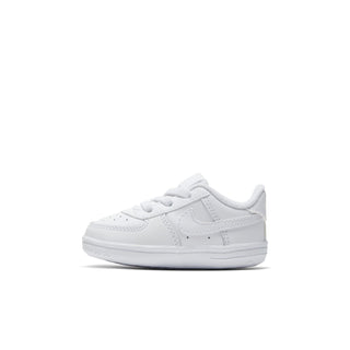 Infant white low-top sneakers, front angled view, lace-up and swoosh logo