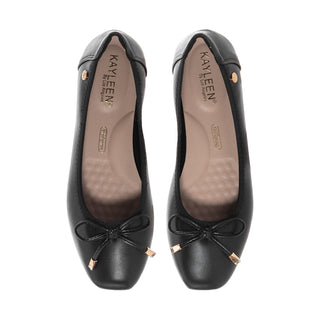 Black womens ballet flats with bow at toe and tan interior lining.