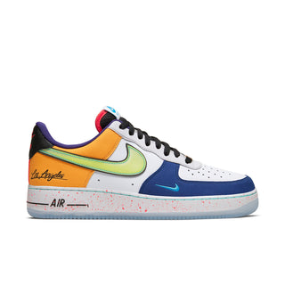 Men's Nike low-top sneaker in white, blue, orange, and green; black laces; speckled sole.