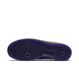 Men's Nike low-top sneaker outsole in dark purple with traction grooves.