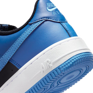 Nike Air Force 1 side close-up: blue collar and white midsole with AIR detail