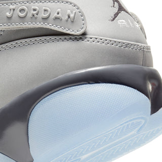 Mens sneaker quarter close-up with JORDAN text and light blue outsole edge