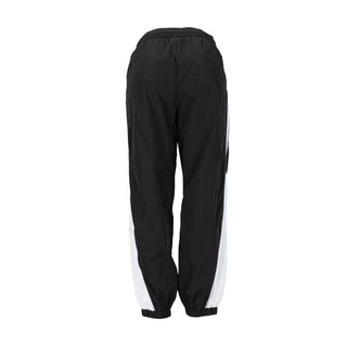 Women’s wind pants back view in black with white stripe accents