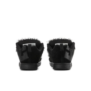 Black women’s low-top sneakers from the back, with ankle strap and lace detail