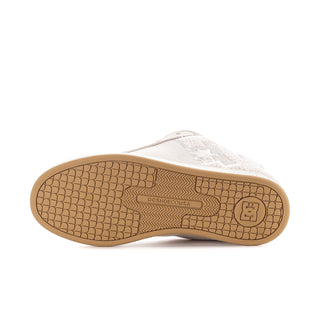 Women’s off-white sneaker outsole with gum tread and embossed brand markings.