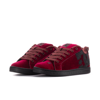 Pair of women's maroon velvet lace-up court sneakers with black star side panels