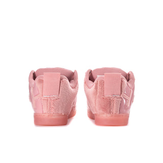 Pink low-top sneakers with rear heel tabs and cushioned ankle collar.