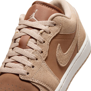 Close-up of light tan Air Jordan 1 low-top laces and suede upper with Swoosh