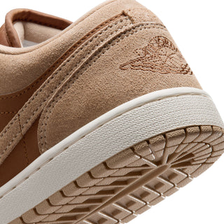 Close-up of tan Air Jordan 1 low-top sneaker outsole and side panel texture