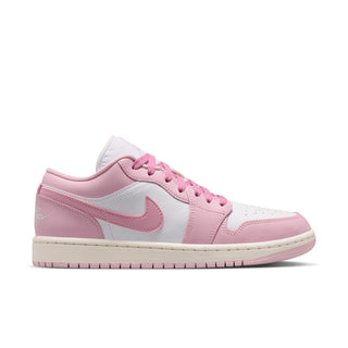 Women's low-top sneakers in pink and white with lace-up front and swoosh logo