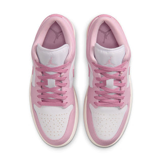Pair of women's sneakers showing padded tongue and lace eyelets in pink
