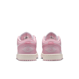 Women's sneakers with pink heel panels, rear branding, and rubber outsole tread