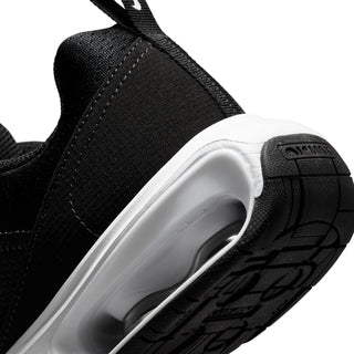 Close-up of youth black heel with white midsole and outsole traction pattern