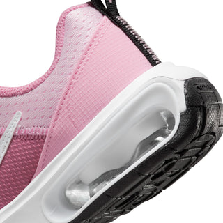 Kids pink sneaker side close-up with translucent Air unit and textured midsole
