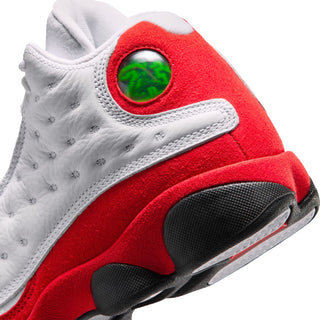 Youth retro shoe detail, red heel with green window and textured black toe cap