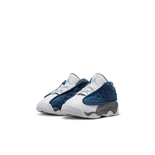 Toddler sneaker pair, white leather panels with navy and light blue mesh