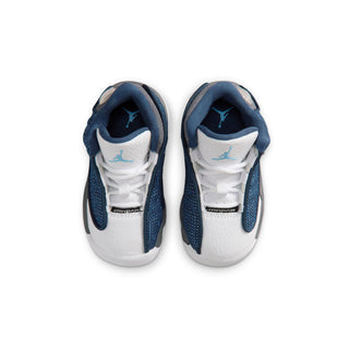 Toddler sneaker front view with white laces and navy padded collars