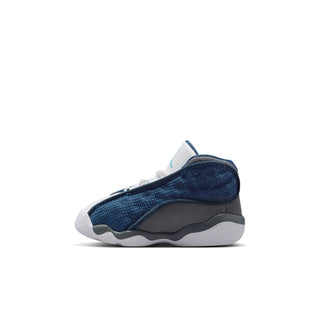 Toddler sneaker side profile, navy mesh overlay with white midsole and gray sole