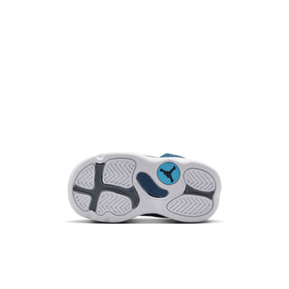 Toddler sneaker outsole view with tread and blue Jordan logo details