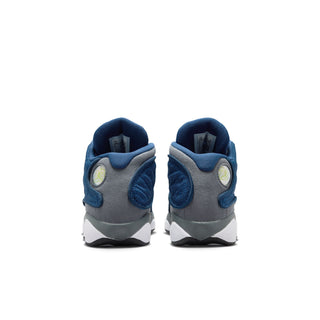 Kids sneakers heel view with blue pull tabs, gray backing, and circular logo
