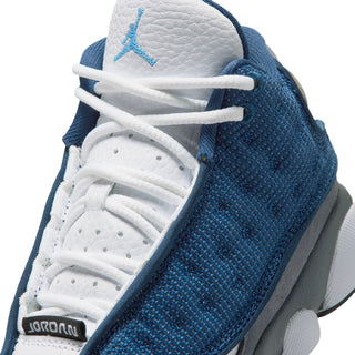 Kids sneaker lace and tongue detail with white laces and blue knit overlay